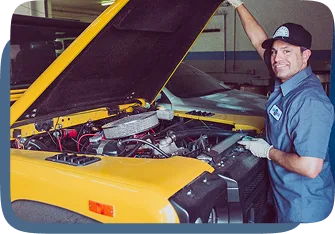 Inspector examining a classic car engine bay